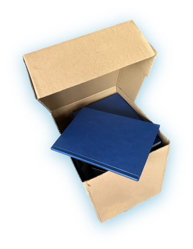 Open box with hardcover books and one book on the top.
